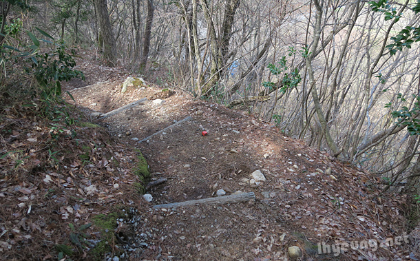 Red cubes along a steep path.