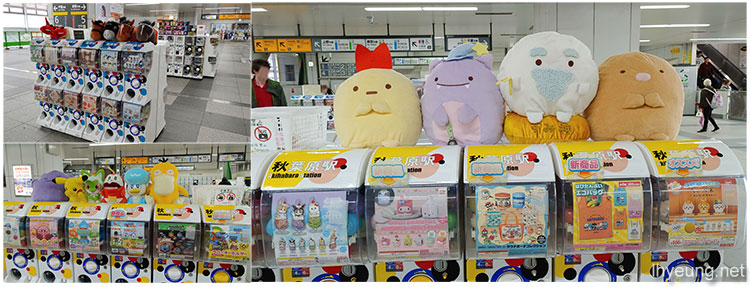 Giant plushies sitting at the Akihabara Station gachapon machines.